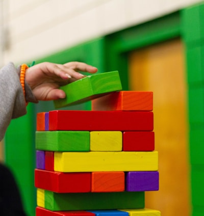 person piling blocks