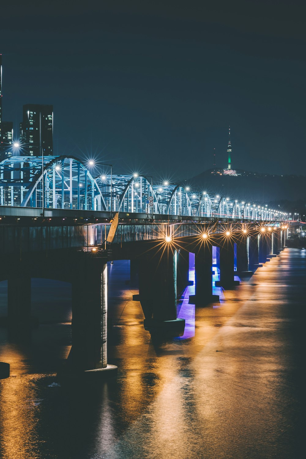 lighted bridge at night time