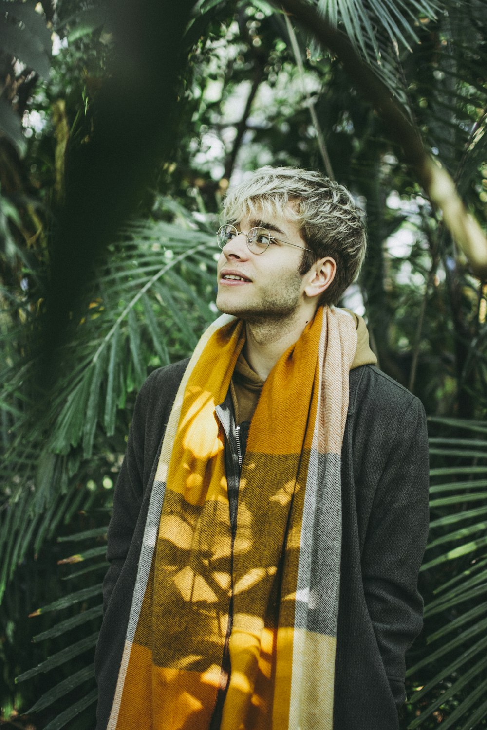 man wearing yellow scarf