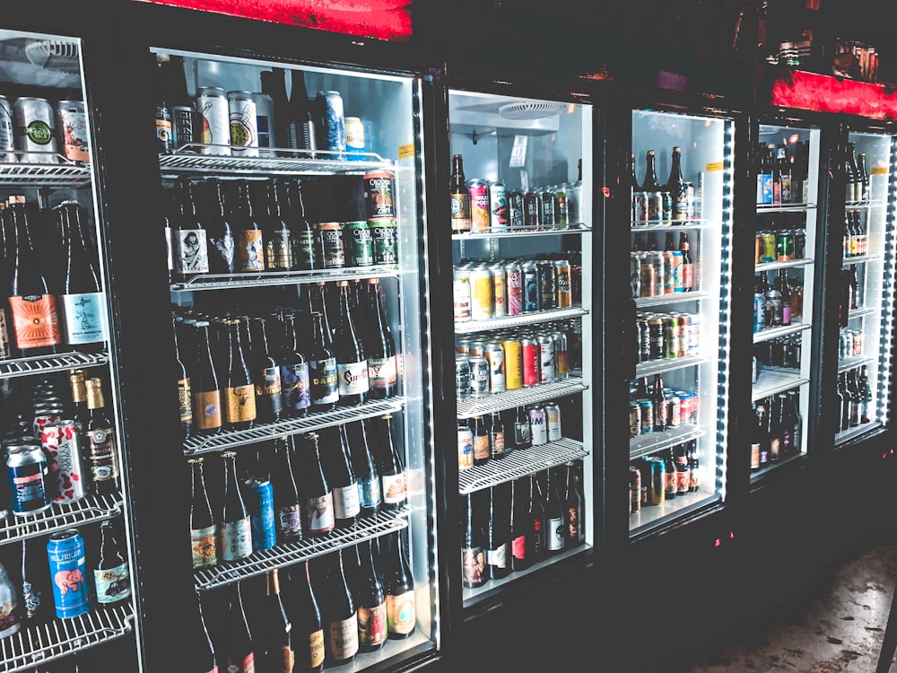 black framed commercial beverage cooler with bottles