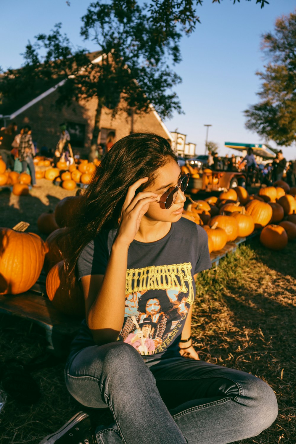 woman sitting beside squash display