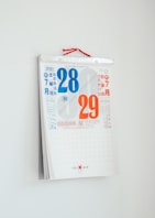 white company calendar on wall