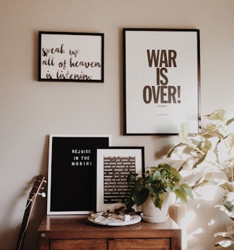 War is Over picture on wall inside room
