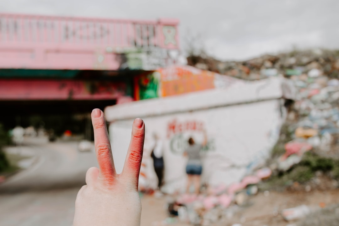 person doing peace sign