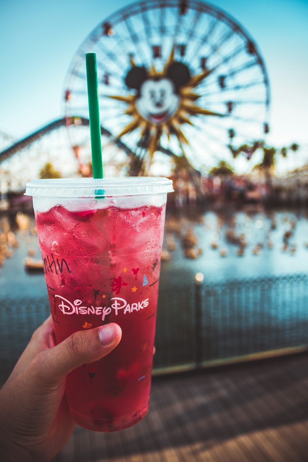 pink Disney Paris drink with green straw