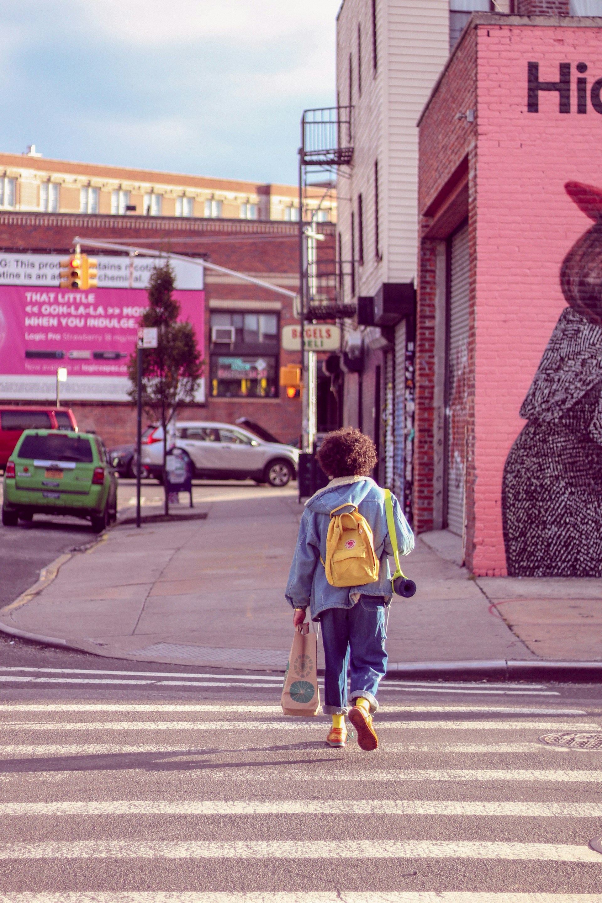 person walking on pedestrian lane during daytime