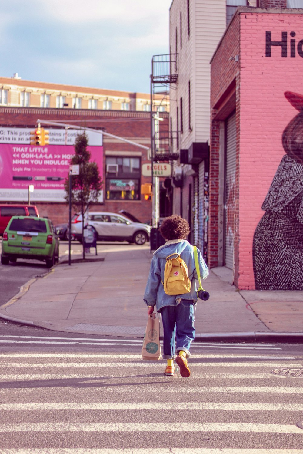 person walking on pedestrian lane during daytime