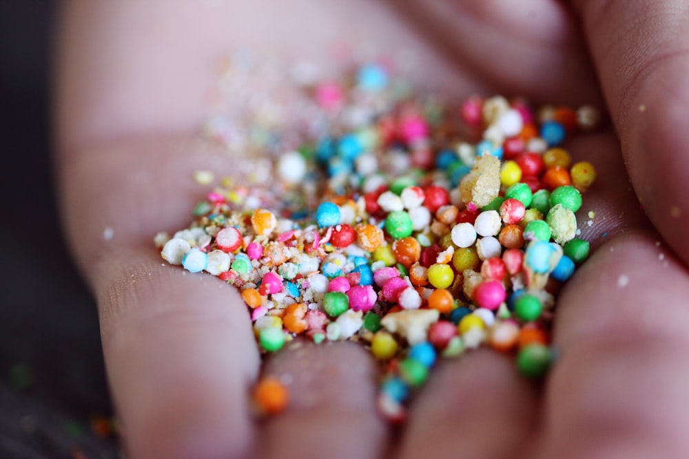 ball candies on person's palm