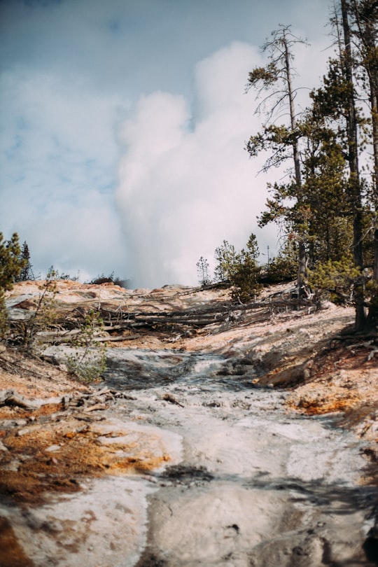 white clouds over steep rock slope in Yellowstone National Park United States