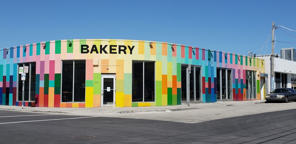 blue, green, and red Bakery shop front under clear blue sky
