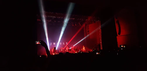 Wide-angle shot of the jungle-themed stage decorated with colorful lights and plants.