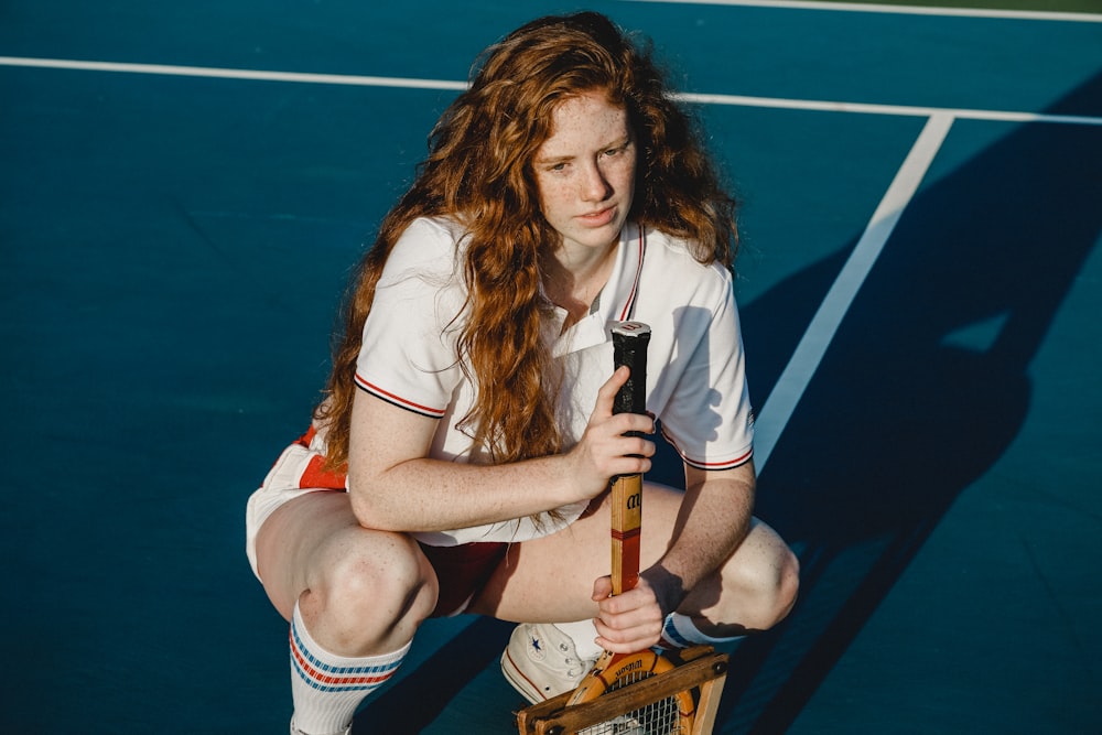 woman holding tennis racket