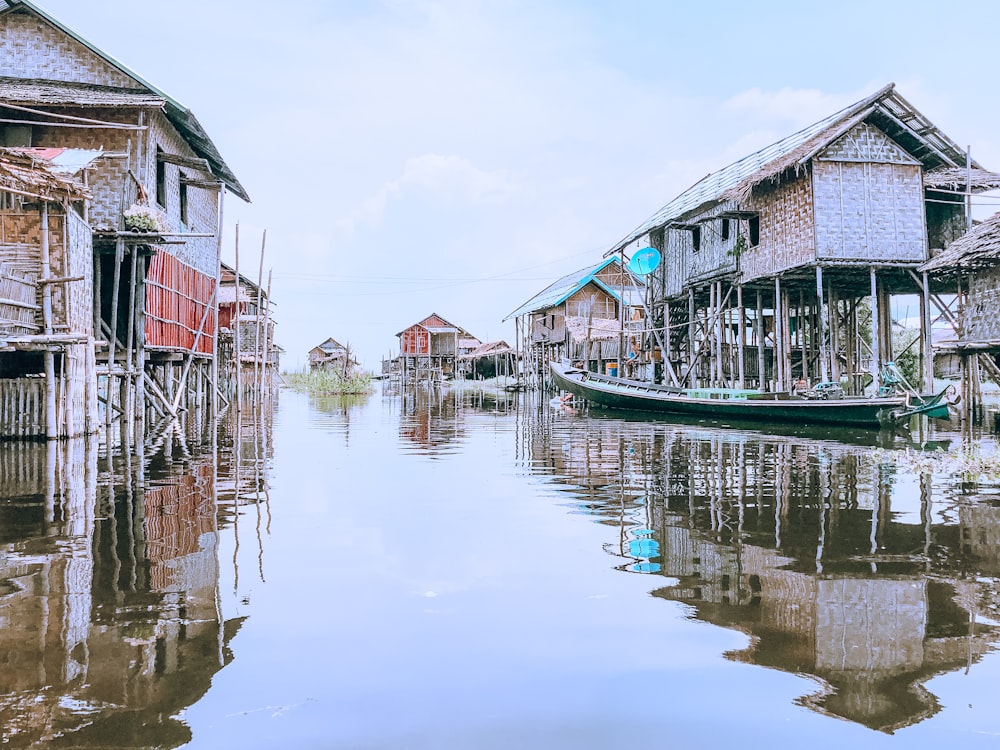 houses above sea water during daytime