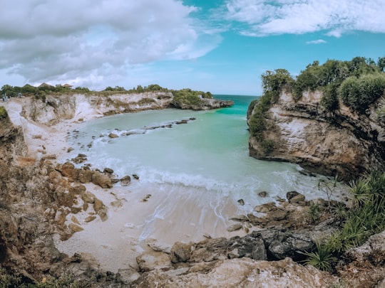 person showing aerial view of ocean in Ceningan island Indonesia