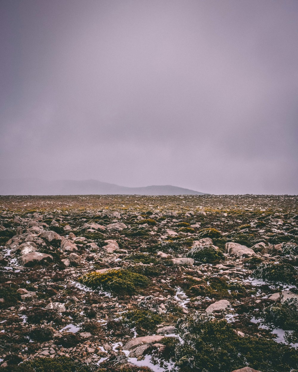 silhouette of mountain with fog