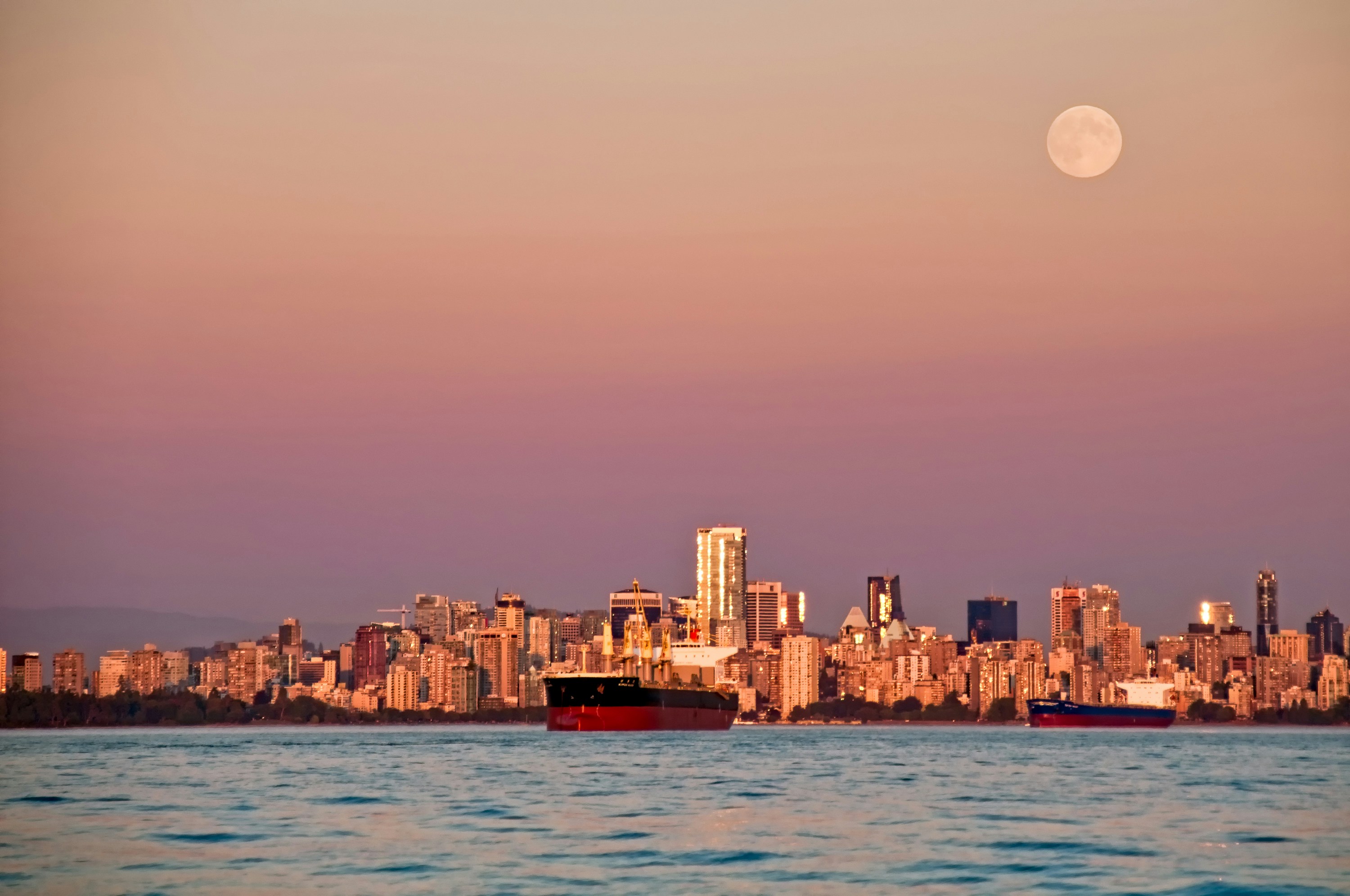 Coming back from salmon fishing at sunset the sunset lit Vancouver as the moon rose above the city, this was one of the last nice days before the clouds of winter came into the city.