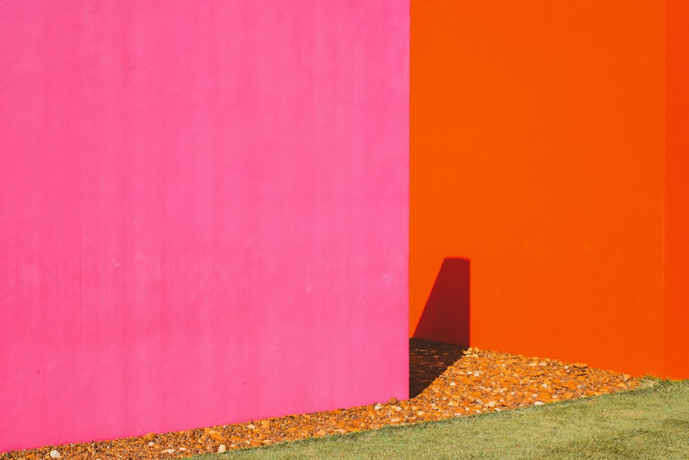 pink painted wall near orange painted wall