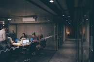 A group of diverse people discussing energy efficiency in a modern office.