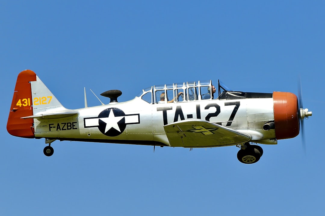 white and brown monoplane illustration, North American AT-6C-1-NT Harvard IIa