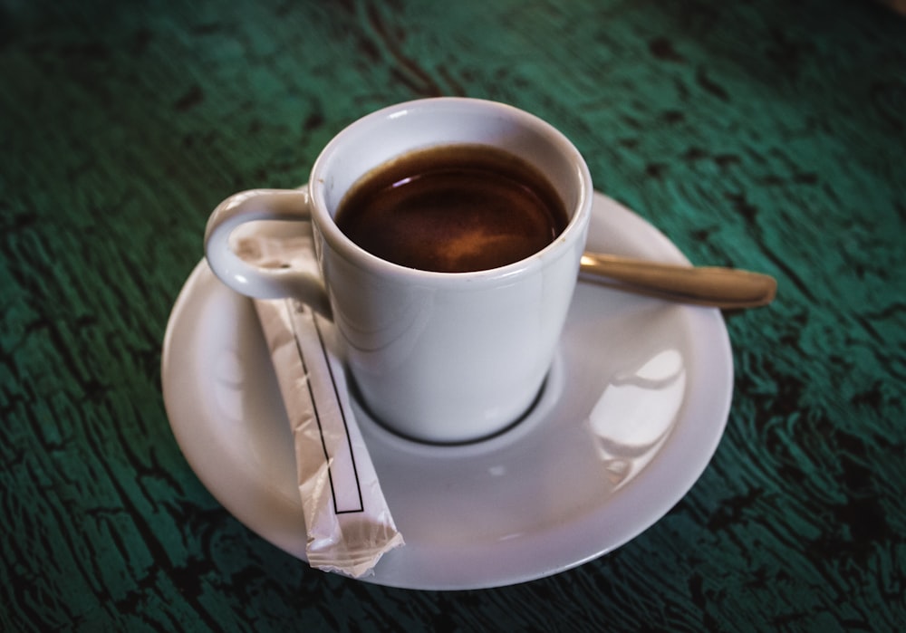 white coffee cup on saucer