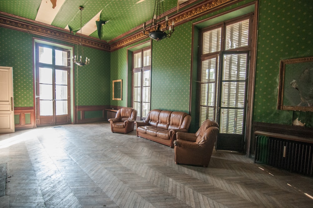 brown leather armchair near brown wooden door