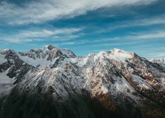 snow-capped mountains during daytime in Fiordland National Park New Zealand