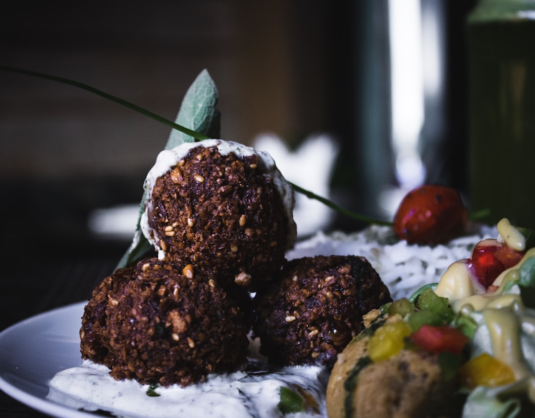 chocolate truffles on white plate,