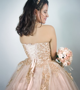 woman wearing pink strapless gown
