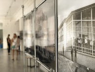 Historic 3D photographs displayed in a softly lit exhibition space.