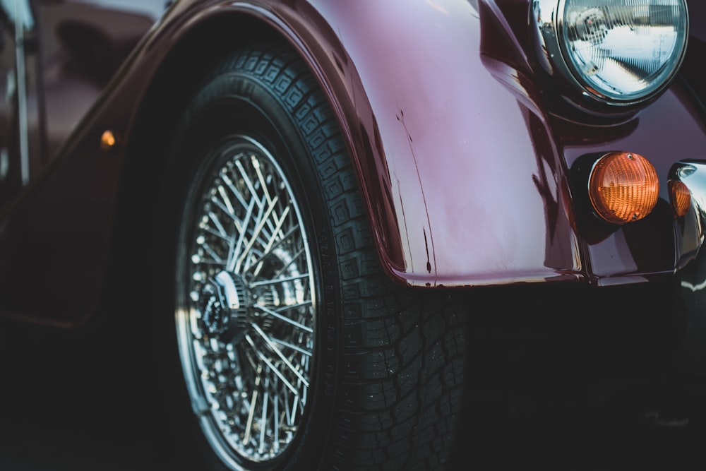 closeup photography of silver-colored vehicle wheel and tire