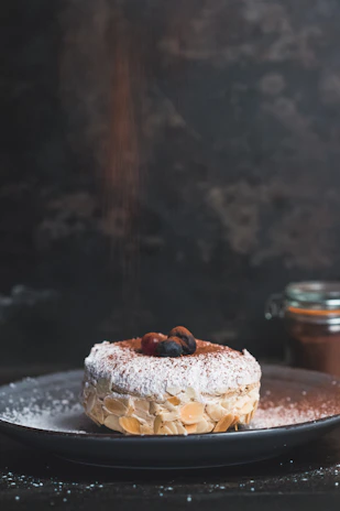 Elegant dessert plate featuring Spanish almond pastries dusted with powdered sugar.