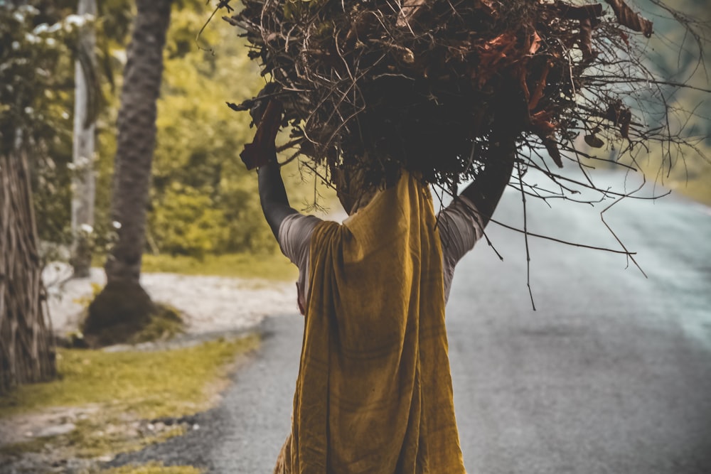 person carrying hay