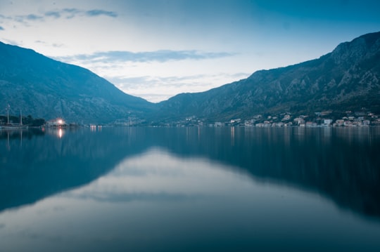 landscape photography of body of water surrounded by hills in Dobrota Montenegro