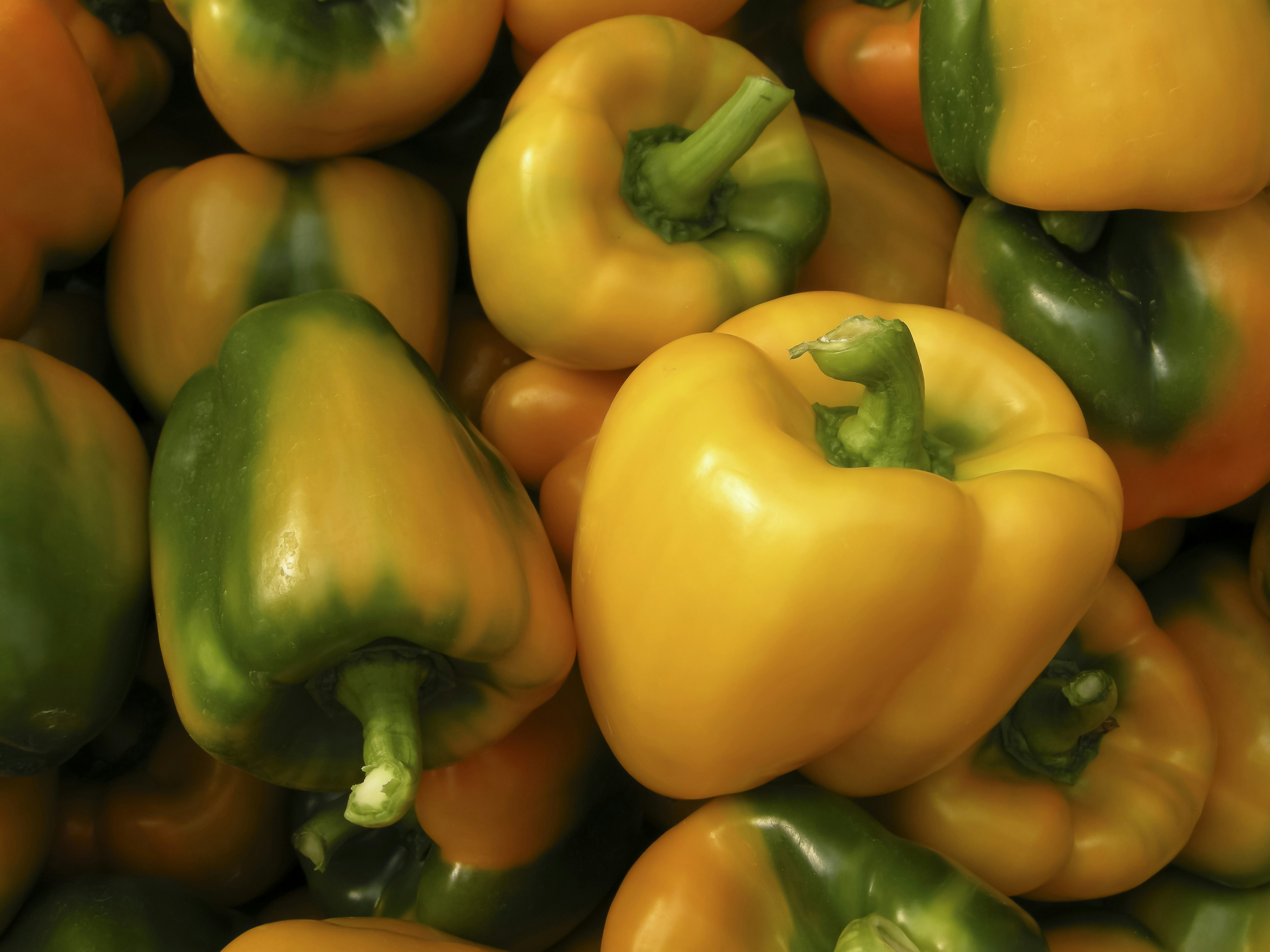 bunch of yellow bell peppers