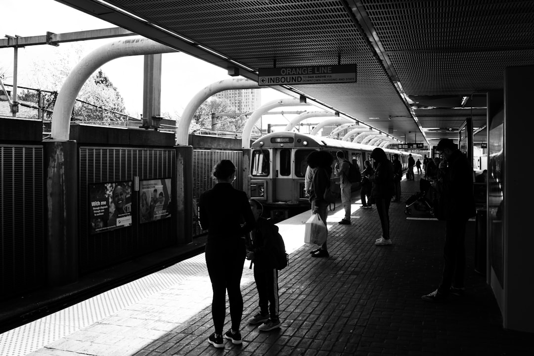 people waiting for the train to stop at the station