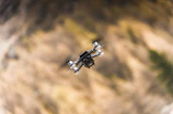 A drone in mid-flight during a student-led aerial robotics workshop.