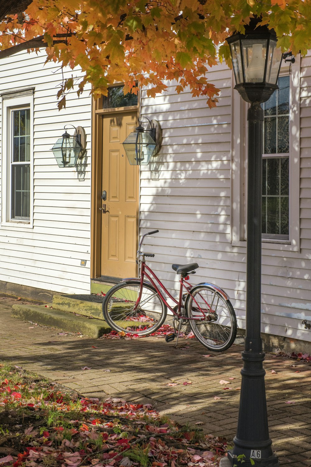 red bike beside house