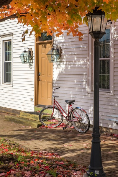 red bike beside house