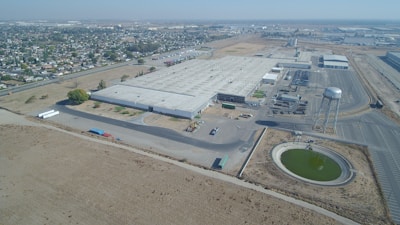 Exterior view of DTS's 10,000 m² facility with industrial warehouses and office buildings.