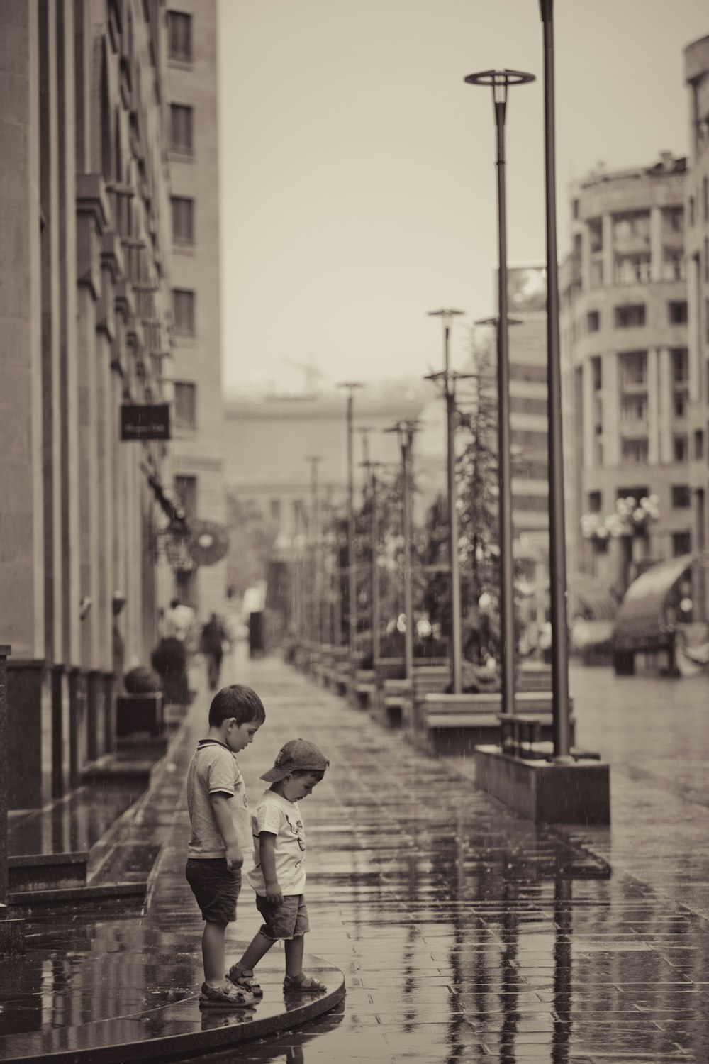 two children standing on streets