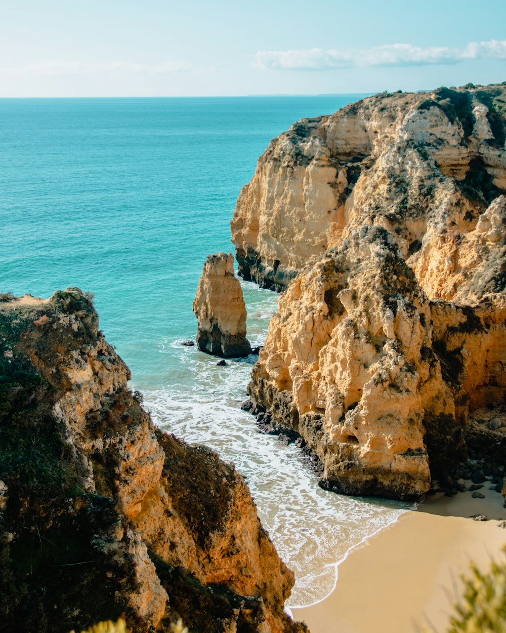 brown rock formation near ocean