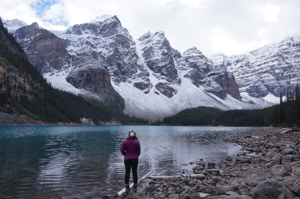 person standing near body of water