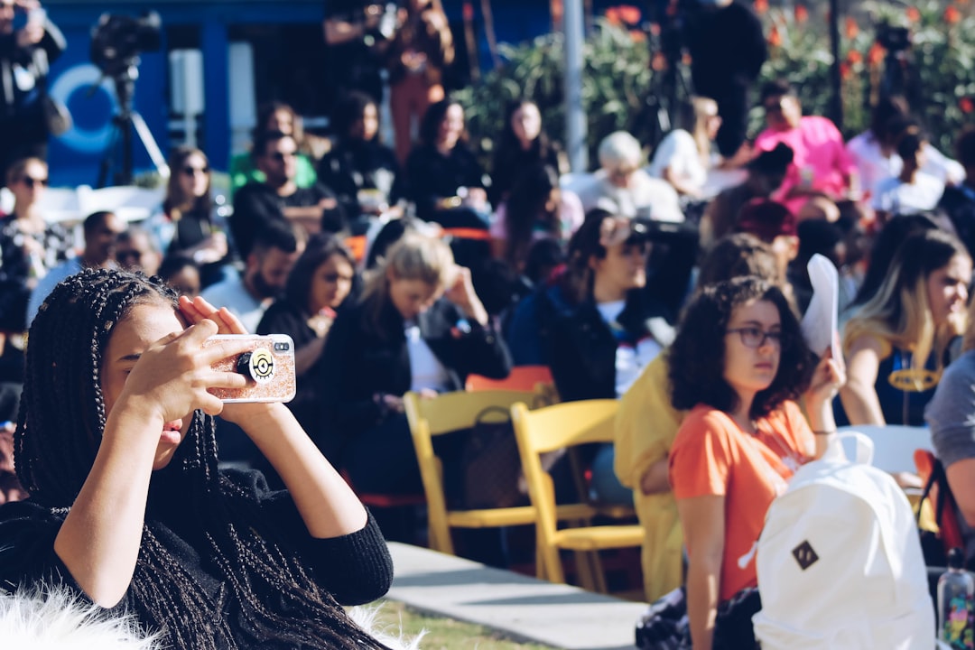 woman holding brown smartphone