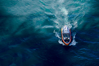 aerial photography of boat on body of water