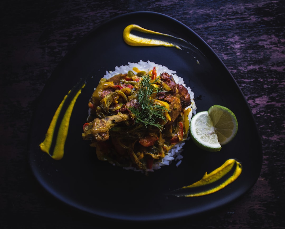 cooked food served on black plate,