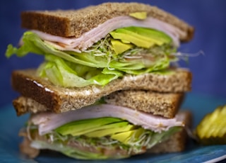 sandwich with ham and green vegetables
