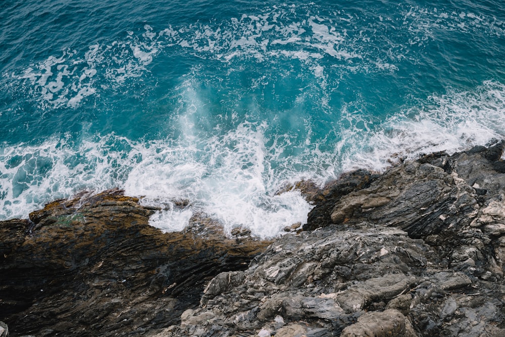 waves breaking on rocks in beach