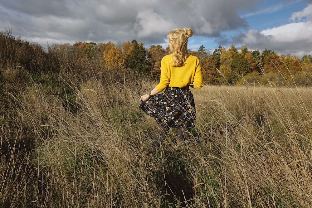 woman standing on grass field