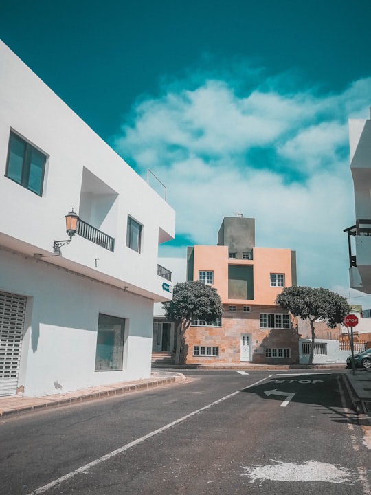 empty road near white and brown buildings in El Cotillo Spain