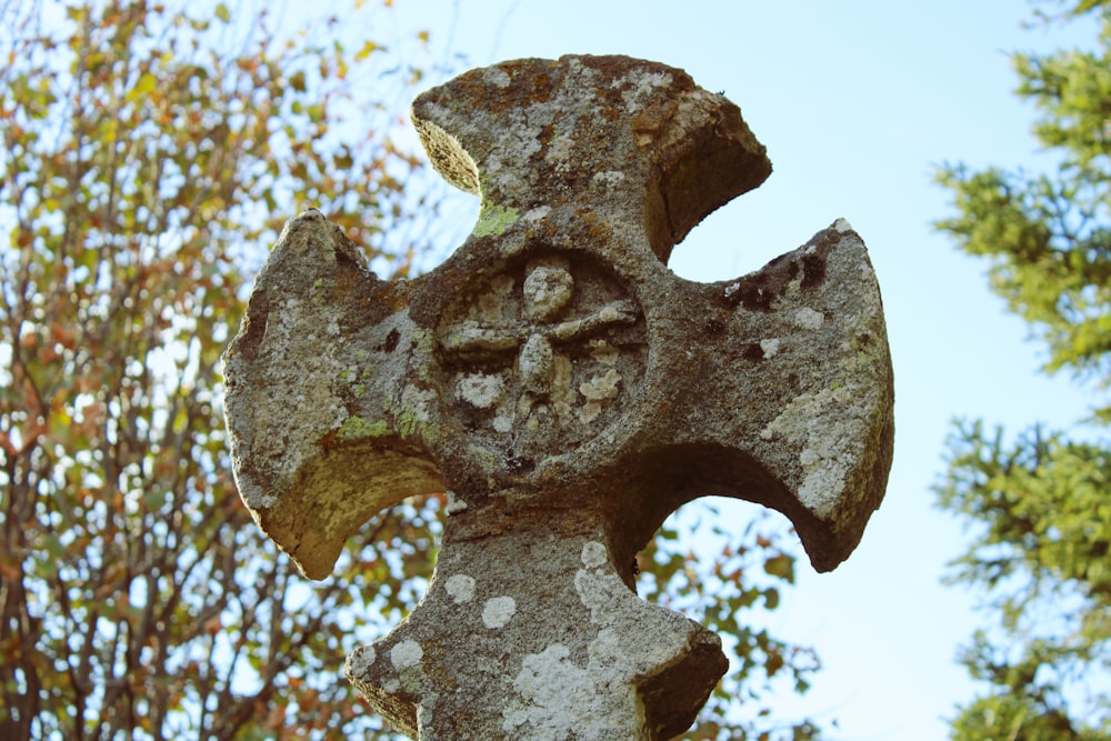 gray concrete cross statue